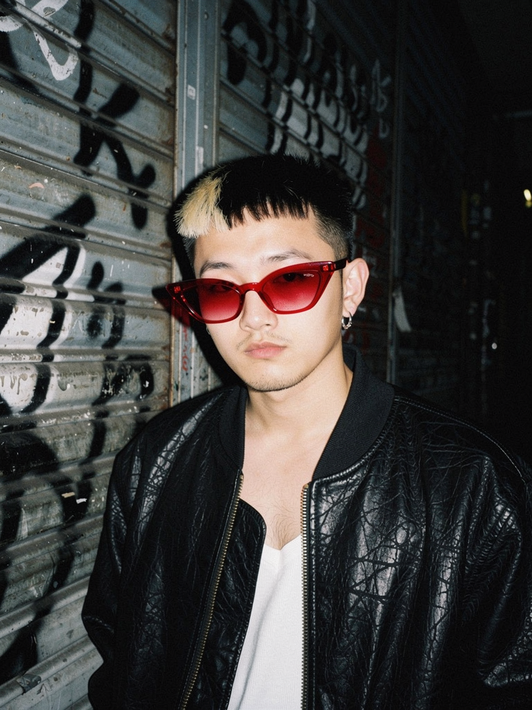 GXD DXMN Crimson Cat-Eye worn at night, flash-lit alley