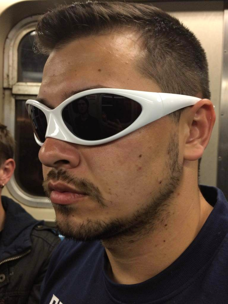 GXD DXMN Mono Small Frame in Bone worn on a night subway